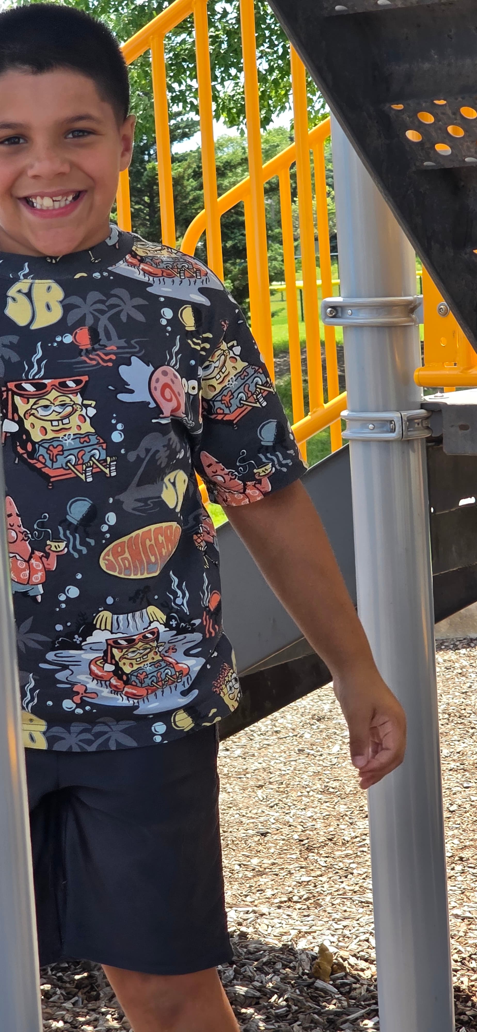 A camper playing outdoors at a playground